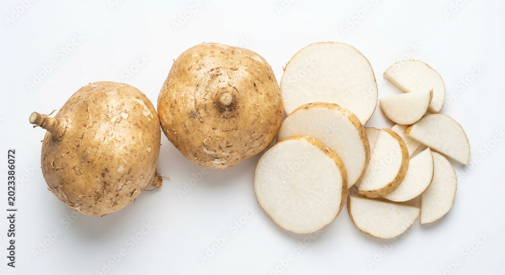Fototapeta premium Whole and sliced jicama on white background