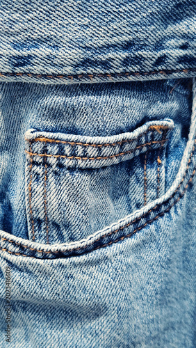 Close-up of a pocket on blue denim jeans