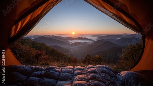 Sunrise view from inside camping tent over mountain range landscape
