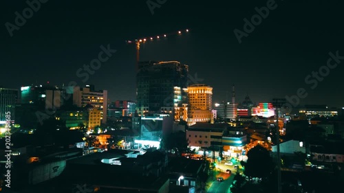 Real Estate and Urban Development at Night – Aerial Drone View of Asian City Skyline with Construction