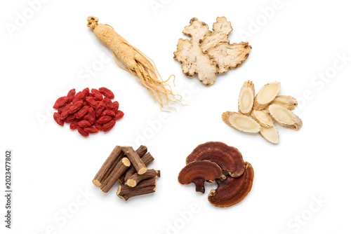 dried chinese herbs arranged in clean circle on pure white seamless background minimalist product photography soft lighting
