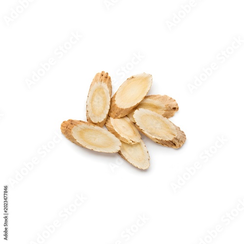 dried astragalus slices on pure white seamless background minimalist product photography soft lighting
