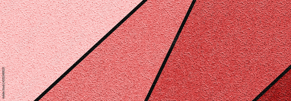 Fototapeta premium ABSTRACT GEOMETRIC PLASTER WALL WITH PINK AND CORAL TONES AND BLACK DIAGONAL SHAPES - MODERN ARCHITECTURE AND STUCCO DESIGN CREATE A CONTEMPORARY ARTISTIC COMPOSITION