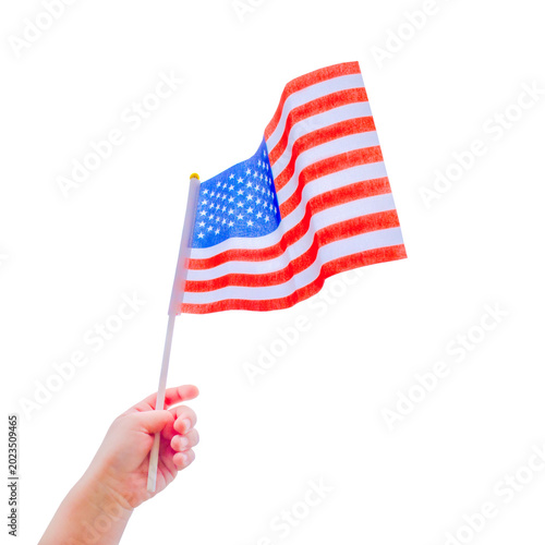 Small US flag is holding a child's hand isolated on white transparent background. Patriotic concept perfect for Independence Day, education, celebrations and American themed designs. 4th of July.