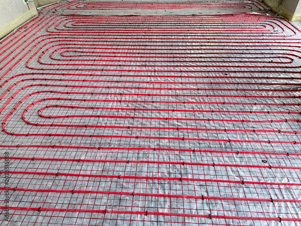 Fototapeta premium Installation of underfloor heating system in building, above view