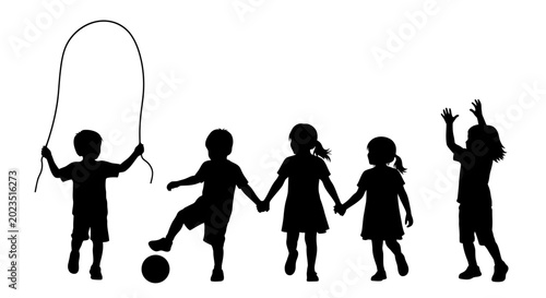 Silhouettes of children playing together outdoors