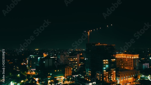 Tower Crane at Night Above High-Rise Construction Site – Urban Development and Infrastructure Growth