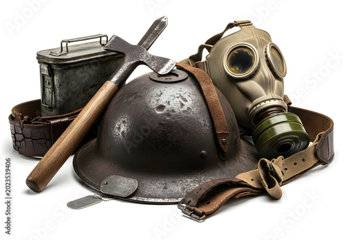 Vintage military gas mask and helmet with rustic tools on aged wooden surface