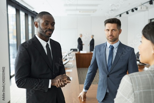 business people shaking hands in office