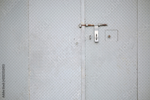 Secure metal door with lock and latch
