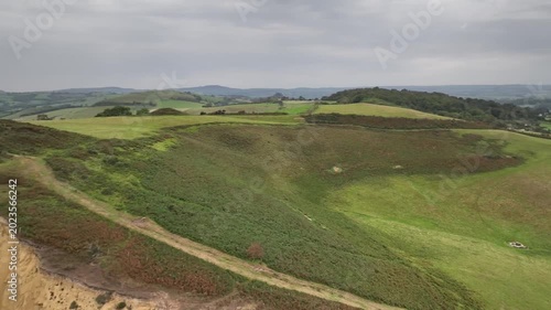Aerial Drone Footage of Rolling Green Hills and Coastal Cliff Edge in Dorset Countryside England
