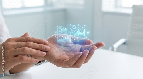 Digital Display of Financial Data Projected from Hand in Modern Office Environment