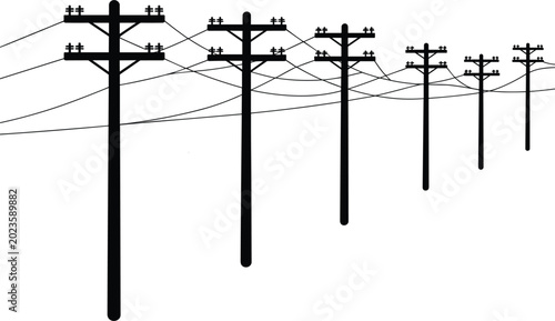Tableau sur toile Row of silhouetted utility poles with power lines receding into the distance ele