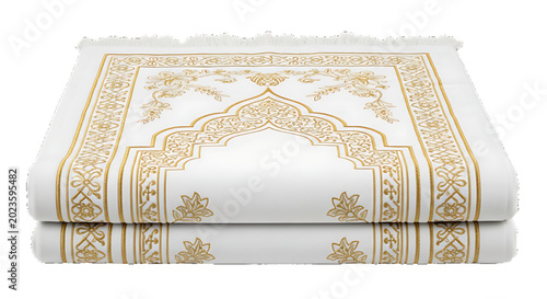 Elegant white prayer mat with ornate gold Islamic patterns, folded neatly indoors