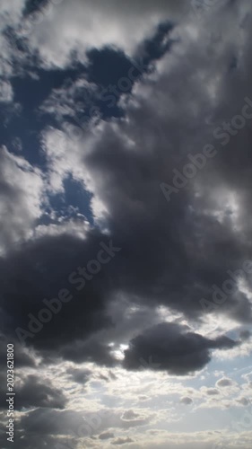 Clouds running in the sky at sunset. 4K Vertical. Time Lapse