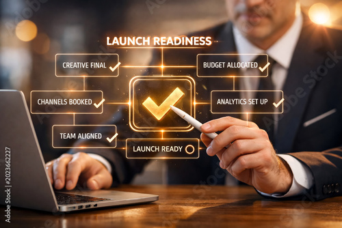 Manager points to a launch readiness status checklist on a glowing holographic screen to confirm the team is fully prepared for the upcoming event.