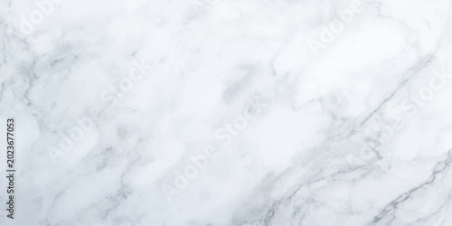 Photos A close-up view showcases the elegant veins and subtle grey swirls of a polished white marble surface, offering a luxurious and timeless texture