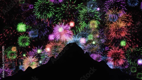 Mountain silhouette at night, colorful fireworks bursting in sky above dark peak