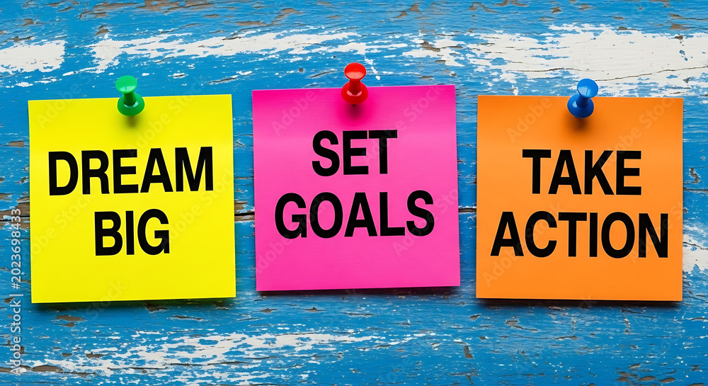 Colorful sticky notes with motivational phrases on blue wooden background