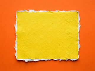 Torn yellow paper on orange background for design and creativity  blank space transparent background
