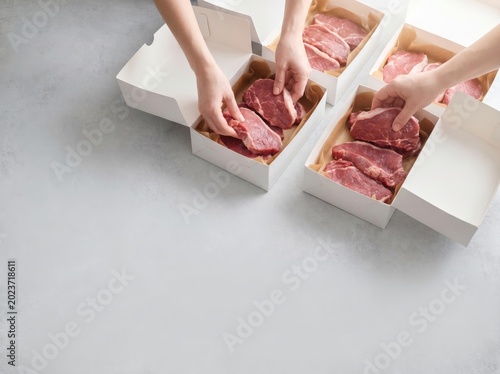 Fresh qurban meat packed into donation boxes for Eid al Adha distribution