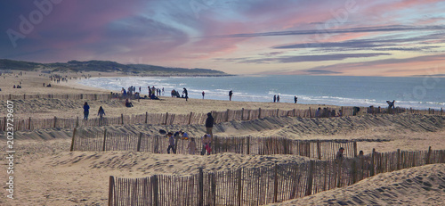Foto Calais beach with wooden fences to protect the beach from the wind before the su