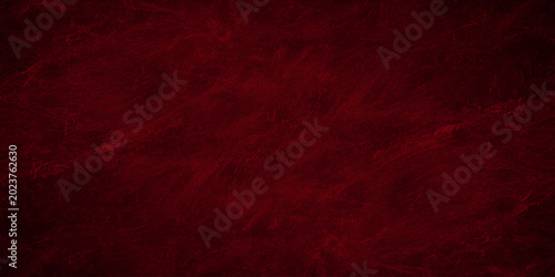 Dark red abstract texture background with textured marble stone pattern effect. moody, dramatic texture displays rich crimson and burgundy tones