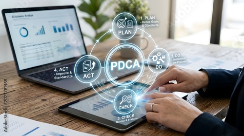 PDCA cycle process improvement concept on laptop screen, business planning, quality management and team workflow
