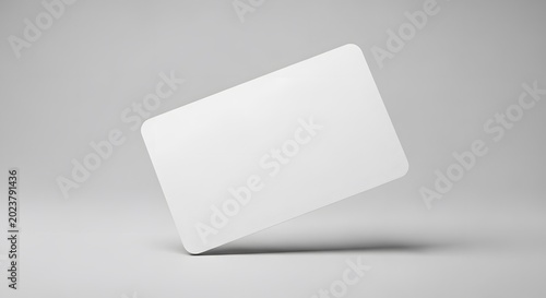 A blank white rectangular card with rounded corners floating in the air against a light grey background, casting a subtle shadow.