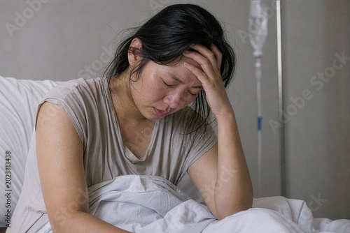 Relentless fever's grip holds a young woman captive in a medical ward