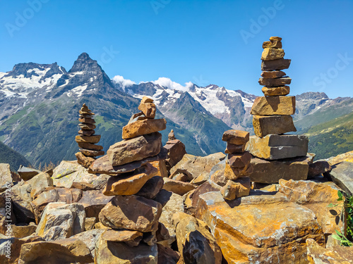 Stone pyramids built by tourists, observation deck on Mount Musa-Achitara, Dombay, Karachay-Cherkessia
