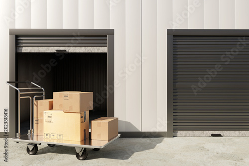Obraz na plátně Self storage facility provides rental warehouse units with moving cart and cardb