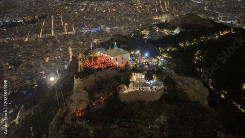 Tableau sur toile Aerial drone night shot of iconic small chapel of Saint George built on top of L