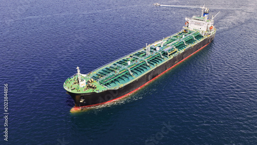 Aerial drone photo of crude Oil tanker ship underway towards open sea, a merchant ship specially designed for chemical products transportation