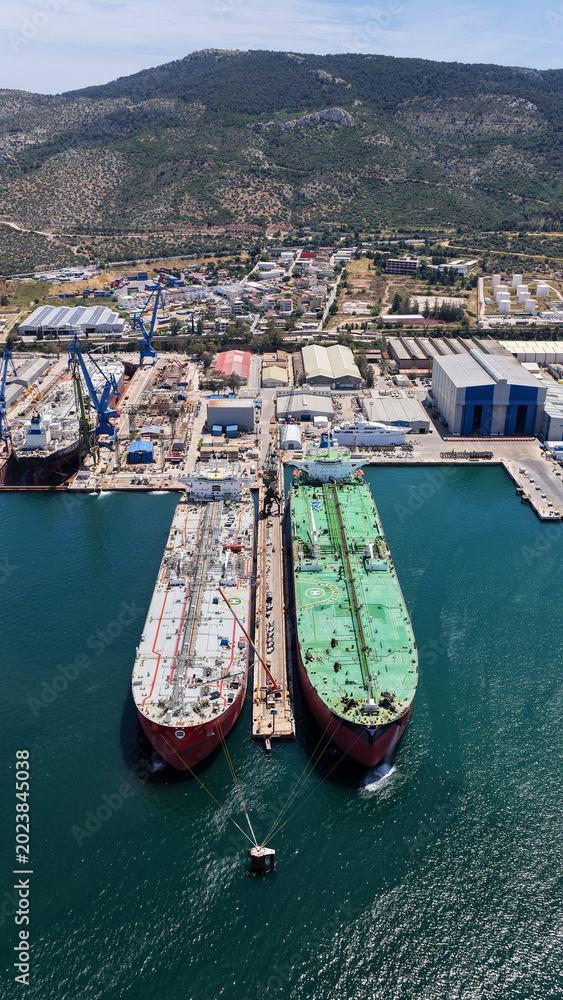 Fototapeta premium Aerial drone photo of famous Skaramangas Shipyards, an emblematic infrastructure in gulf of Elefsina, West Attica, Greece