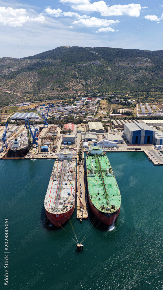 Fototapeta premium Aerial drone photo of famous Skaramangas Shipyards, an emblematic infrastructure in gulf of Elefsina, West Attica, Greece