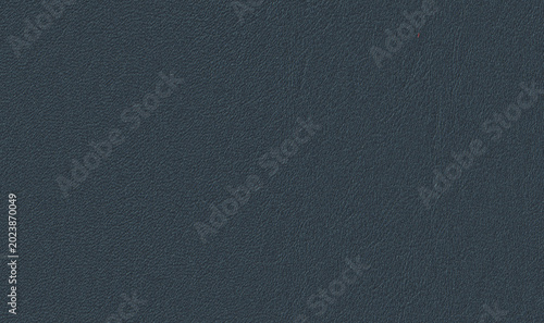 Dark blue leather texture background. High resolution close-up of navy blue leatherette material.