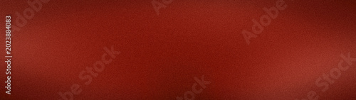 A premium wide abstract grainy background texture in rich red, maroon and burgundy shades