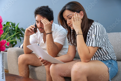 Fotografija Couple dealing with financial stress, debt, receiving bad news