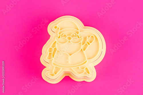 plastic molds for making Christmas cookies on  background