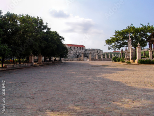 Plaza de Armas in Old Havana Cuba with historical colonial architecture alongside Castillo de la Real Fuerza