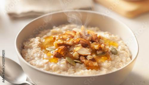Gourmet Oatmeal Bowl with Nuts and Honey Close-Up