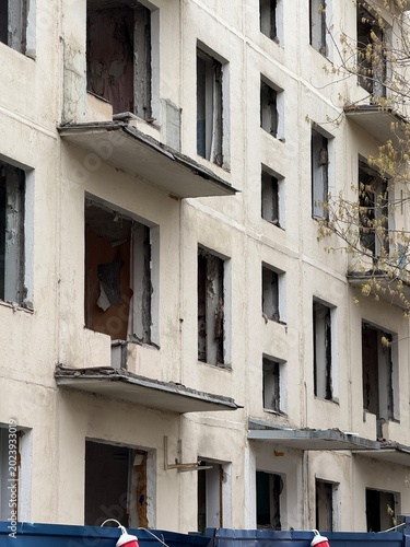 old abandoned residential building urban decay peeling paint broken windows