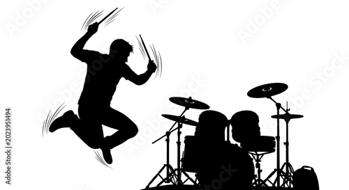 Obraz na płótnie Silhouette of a drummer jumping with drumsticks, energetic performance
