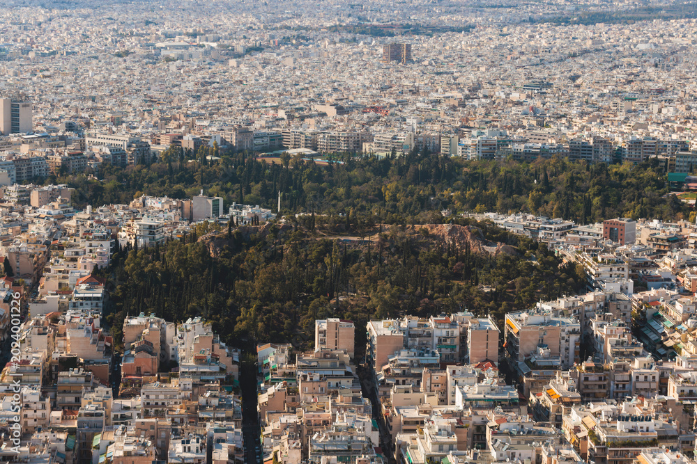 Fototapeta premium Athens, Attica, Greece, beautiful panoramic view of Athens cityscape, with The Parthenon, mountains, sea and scenery beyond the city, seen from Mount Lycabettus Hill observation deck in a sunny day