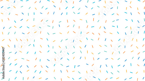 Foto Tiny blue, orange, and turquoise candy sprinkles randomly dispersed on a clean w