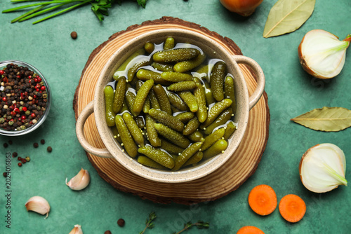 Bowl with tasty pickled cuc...