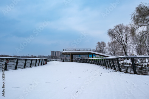 Snow Scenery of Hailong Lake Scenic Area in Meihekou, Jilin Province, China – Urban Ecological Park and Lakeside Landscape Covered in Late Spring Snow – April 4, 2026