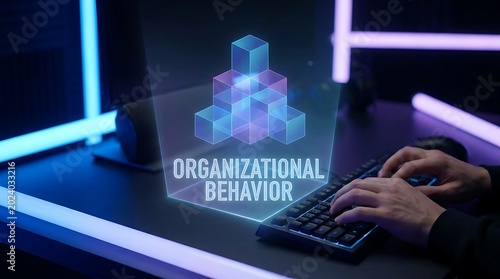 Holographic display of organizational behavior with hands typing on a keyboard.