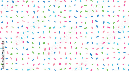 A charming composition of bright pink blue and green sprinkles scattered on a pristine white surface